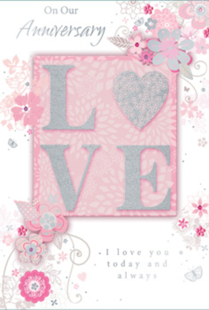 The anniversary card depicted here has a gentle, timeless charm, recalling the thoughtful attention a local Cowley florist might give to a bespoke romantic bouquet. At the heart of the design lies the word LOVE, spelled in wide, uppercase letters that rise softly from the card surface. A veil of fine glitter rests on these letters, giving them a frosted sheen that catches the light in subtle glimmers rather than bold flashes. This tactile detail adds dimension, encouraging the recipient to trace the word and feel its presence beneath their fingers. Surrounding the central motif, an intricate pattern of stylised blooms, slender leaves, and curling tendrils arcs across the card in loose, flowing lines. The flowers are drawn with light, illustrative strokes, suggesting petals and buds in delicate hues of blush pink, ivory, and faint lilac, while touches of silver outline or highlight certain elements, lending a hint of quiet luxury. The background is a consistent blush-pink wash, soft and even, reminiscent of the gentle colour of early evening skies over Cowley's gardens in late spring. Tucked within the floral tracery, an anniversary message is set in an elegant script, its lettering graceful and measured, echoing the curves of the vines. The sentiments it carries-love honoured, time shared, memories treasured-seem to breathe through the delicate arrangement around it. Overall, the card radiates a serene certainty, suggesting a relationship that has weathered busy days and quiet nights, like the steady rhythm of life in Cowley, and still returns, year after year, to the simple, enduring promise captured in that single shimmering word at its centre.